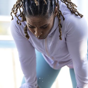 african american woman sweating after hard workout