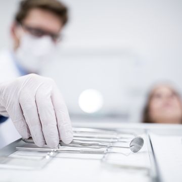 dentist holding angled mirror