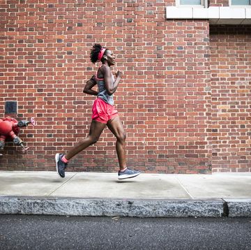 female running through urban area