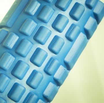 Foam physiotherapy, fitness sports self massage roller used to roll out tired, sore muscles, tension, strains and to increase muscle flexibility