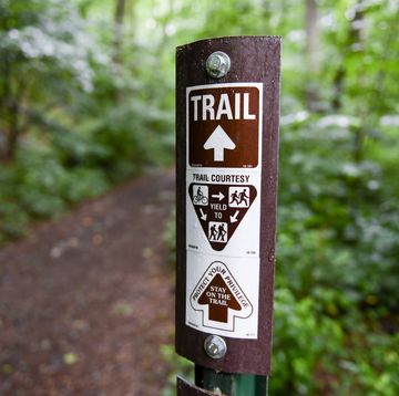 lower alsace township, pa   june 22 a trail marker that reads trail with an arrow, a graphic that reads trail courtesy with a graphic instructing people on bicycles to yield to runners and hikers, and runners to yield to hikers, then an arrow with the text protect your privilege, stay on the trail in the neversink mounatin preserve in lower alsace township tuesday afternoon june 22, 2021 photo by ben hastymedianews groupreading eagle via getty images