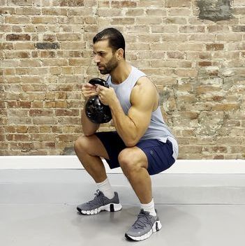 Tamir practicing the goblet squat exercise tamir practicing the goblet squat exercise