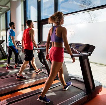 12 3 30 workout group of athletic people warming up on treadmills in gym