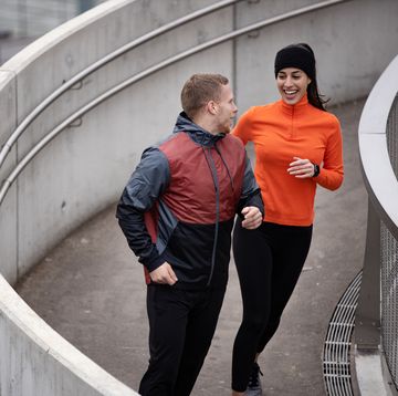 high angle view of a happy caucasian couple exercising together in the city