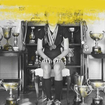 all star teen athlete surrounded by trophies