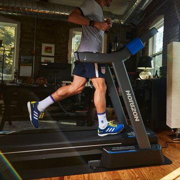 running in living room on horizon folding treadmill