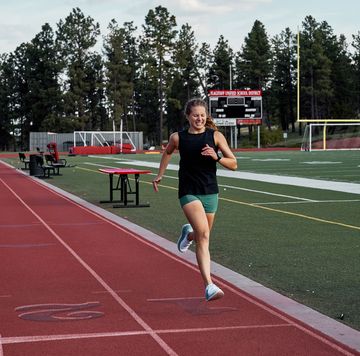 woman running on track