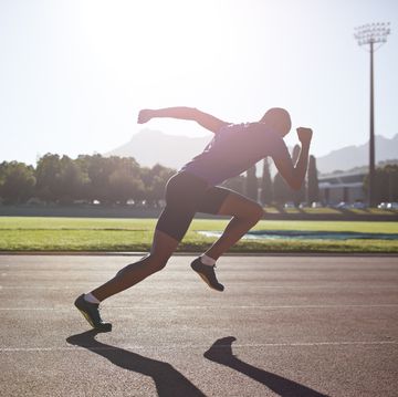 male athlete sprinting out of start block, anaerobic exercise