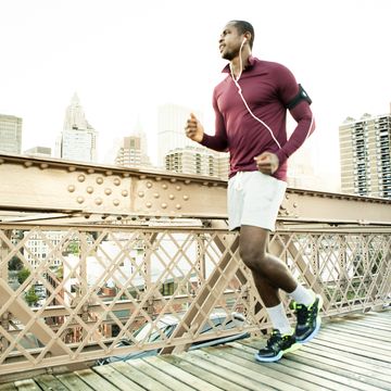 Man running on the brooklyn bridge Man running on the brooklyn bridge