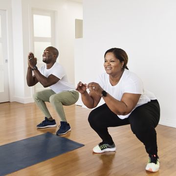 mature adult couple doing exercise at home, move run workout indoors
