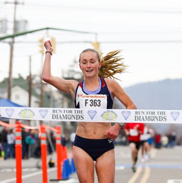 paige stoner of charlottesville, virginia crosses the finish