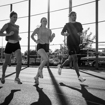 Periodized Training Session runners in a group on a track