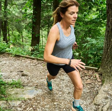 jen acker running up a trail in the summer jen acker running up a trail in the summer