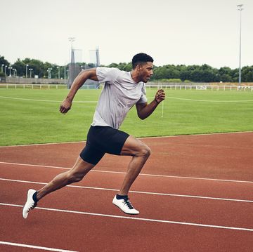 runner training on running track, mile repeats