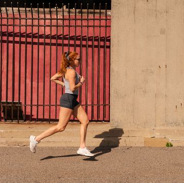 woman running on street running economy