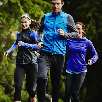 Smiling group of friends running together