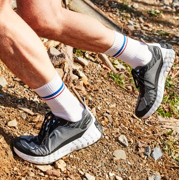 pat heine wearing a pair of norda shoes while trail running