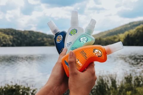 holding kinesys sunscreen bottles