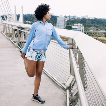 Woman Enjoying Run on Urban Bridge quad dominant woman enjoying run on urban bridge