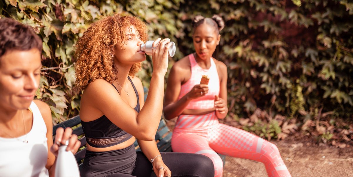 Women sitting on the bench and refreshing after practice, top nutrition stories 2022 women sitting on the bench and refreshing after practice, top nutrition stories 2022