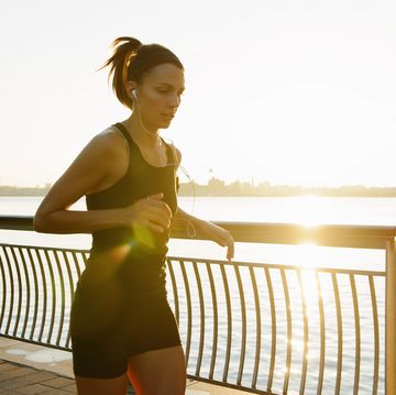 marathon taper Young female jogger running at sunrise