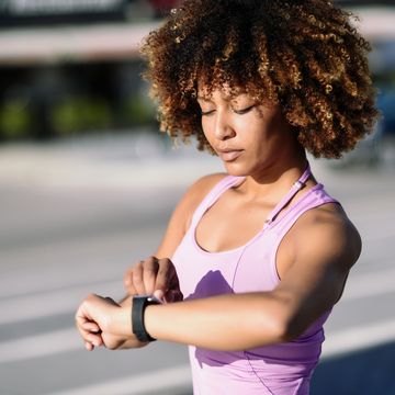 young woman running on road